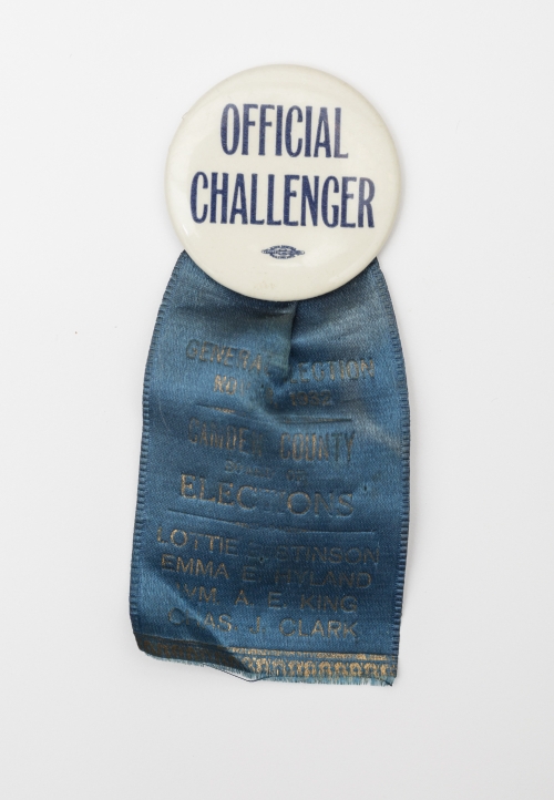 archival political button with ribbon