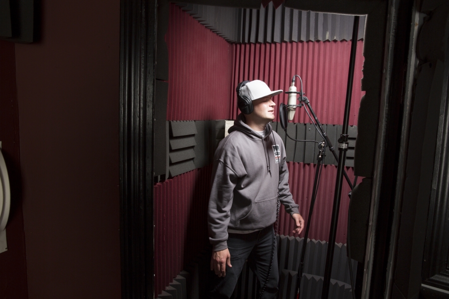 rapper Scott Samels ’99 performs in a recording studio