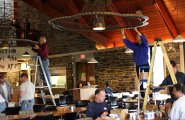 students, staff switchout sharples lightbulbs