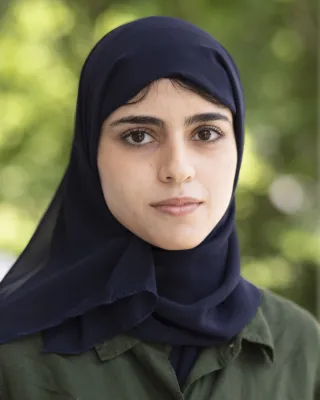 Rania looks at the camera