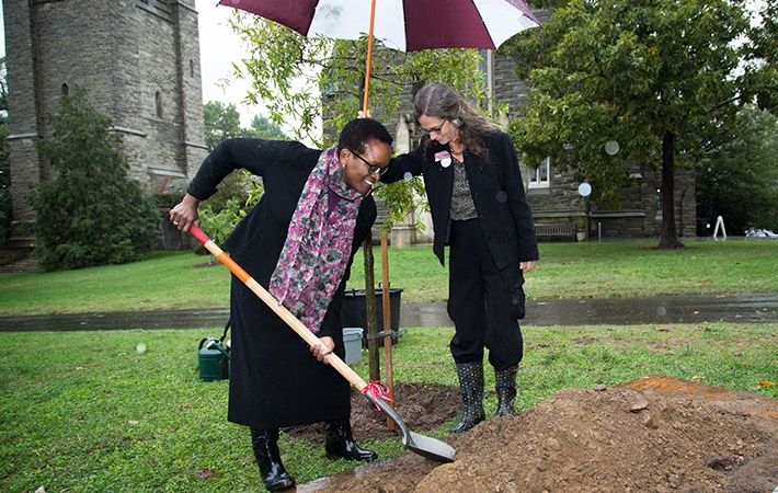President Valerie Smith at the tree planting