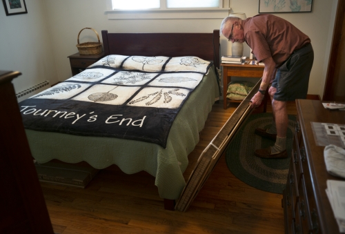 Sandy Lamb ’55 shows the cardboard caskets he and his wife have purchased
