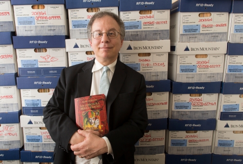 Alan Gordon ’81 holds a copy of his book