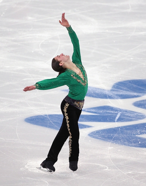 Jason Brown strikes a dramatic pose during day two of the Sochi 2014 Winter Olympics, wearing the pants Jo Lynne Johnson ’72 tailored.