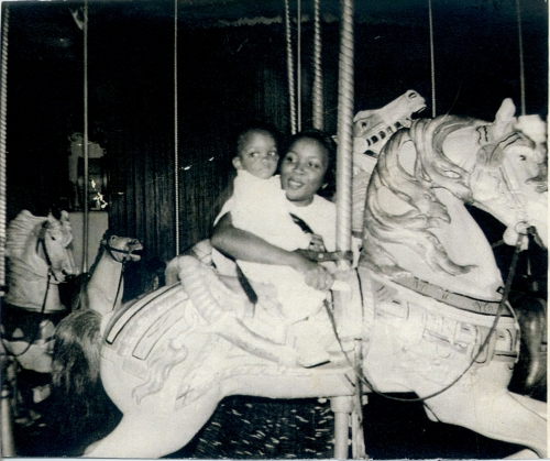  Baby Val enjoys a merry-go-round ride with her mother at Prospect Park, Brooklyn 