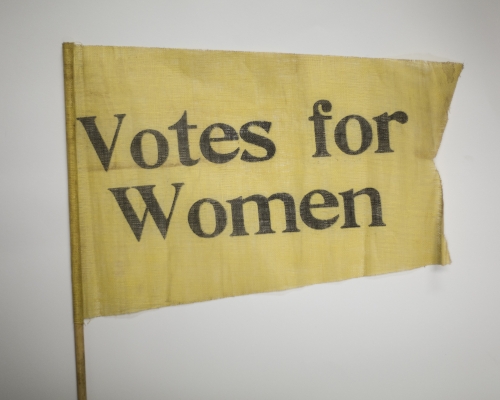 archival banner that says "Votes for Women"