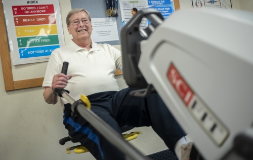 Bob Barr using a gym bike