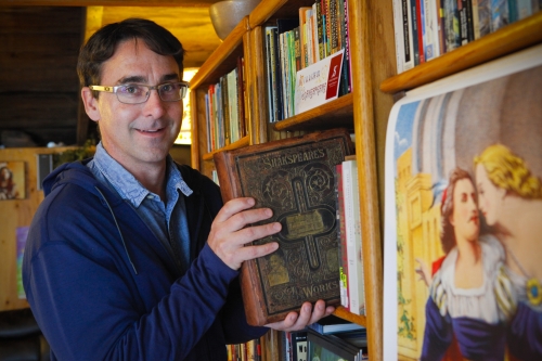 Crispin Clarke ’98 holds his volume of Shakespeare