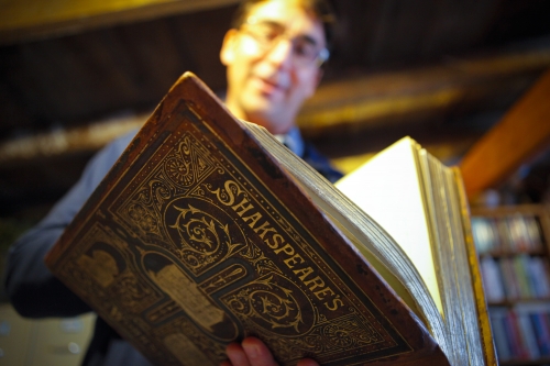 Crispin Clarke ’98 holds up his volume of Shakespeare