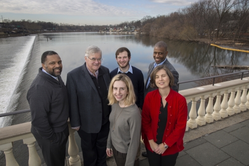 A group of people stand overlooking the Philadelphia Water Works