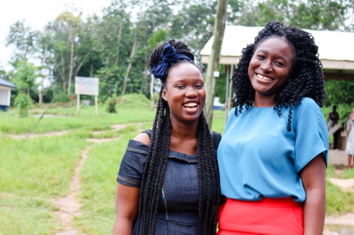 Women stand smiling in Africa 