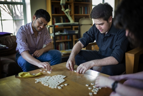 Two male students playing Bananagrams