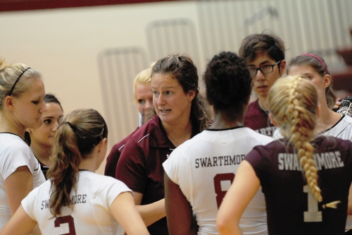  Volleyball Coach Harleigh Leach Chwastyk is a woman talking to the female athletes around her. 