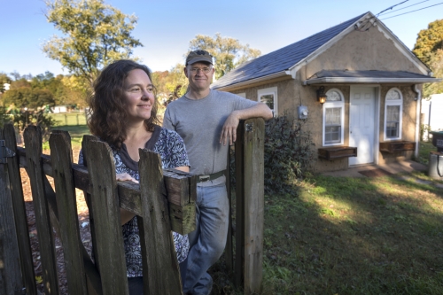 Steve and Laura Snyder Brown outside a small home at Casa Alma