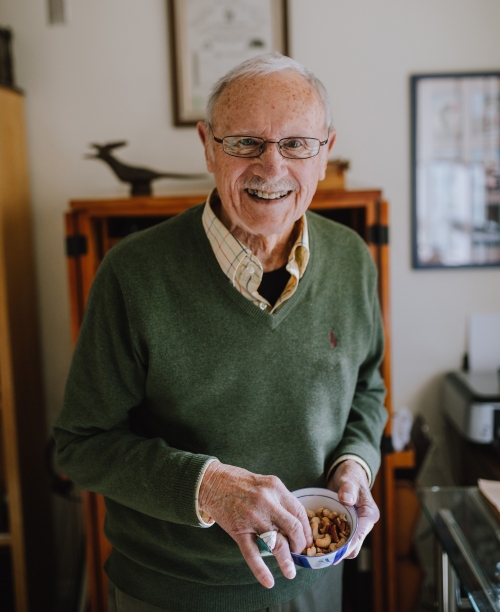 Keith Culverson holding a bowl of nuts