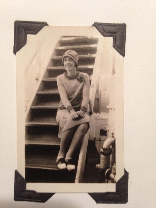 woman seated on stairs on a ship