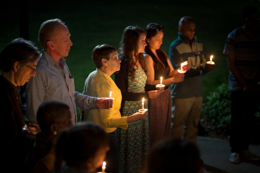 a shot from the left of the candlelight vigil attendees