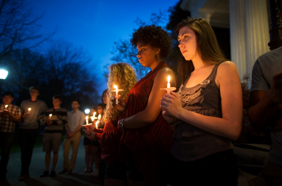 close up of students holding candles