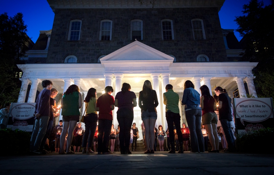 Students form a semicircle in their candlelight ceremony in front of Parrish