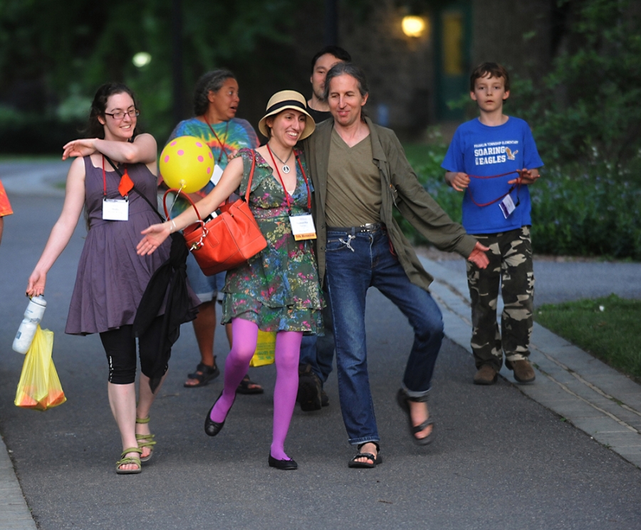 colorfully dressed alumni walk on campus