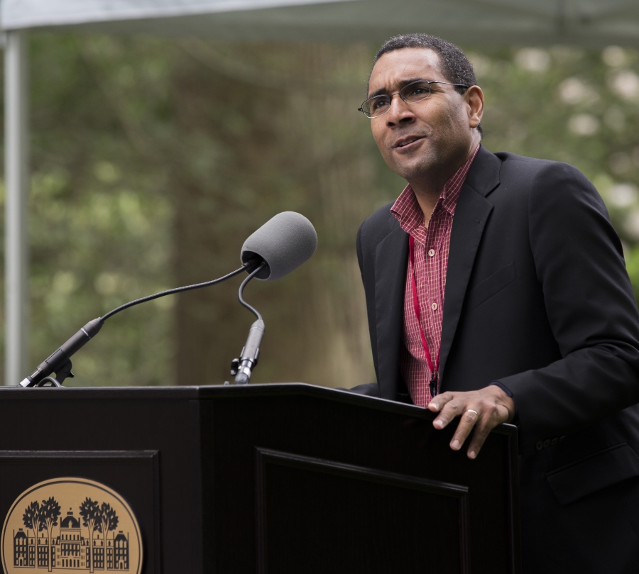 a man speaks at a lectern