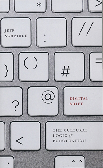 The cover of The Digital Shift featuring punctuation marks on a computer keyboard