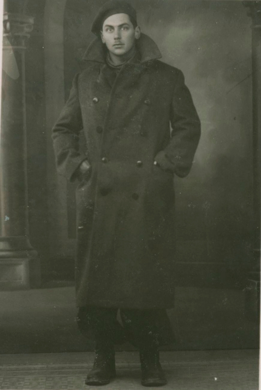 A portrait of a man in large coat