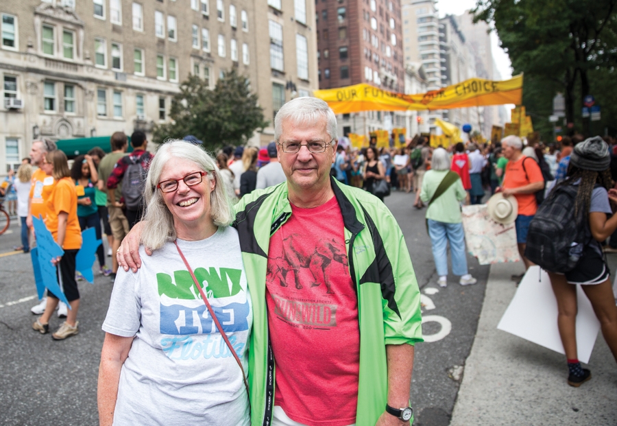 Swarthmore Matchbox alumni (from left to right) Linda Cox '71 and John Robinson '71, an older couple, at the People's Climate March in New York City.