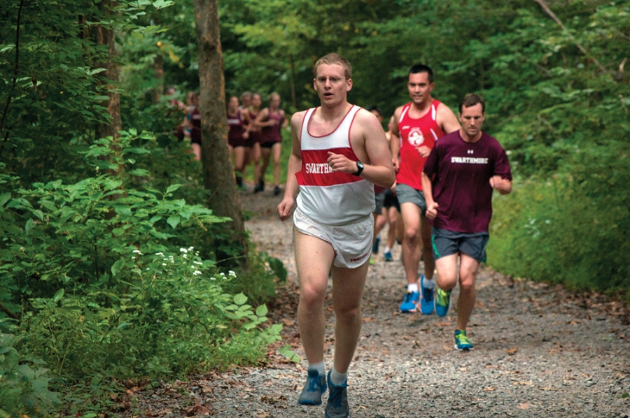 Runners run through the Crum woods.