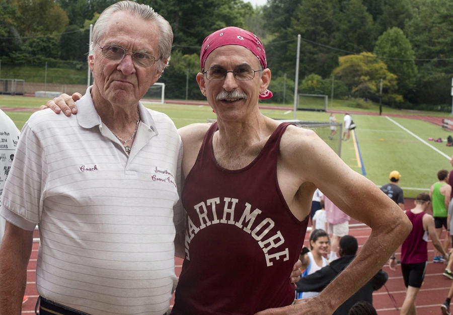 Two men are standing beside each other after a run.