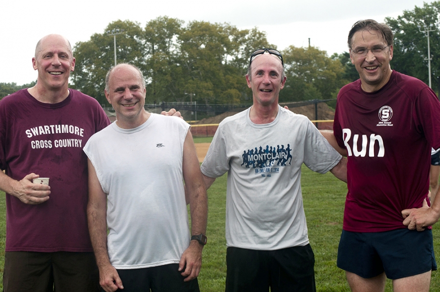 Former teammates John Bowe '83, Steven Cangemi '83, David Crow '80 and Chris Smith '83 stand beside each other after a run.