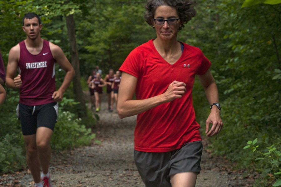 Runners run through the Crum woods. 