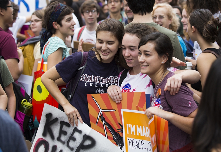 (From left to right) Natalie McLaughlin '17, Gracie farley '17, and Indy Reid-Shaw '17 hold posters for the People's Climate March. Photo by Martin Froger-Silva '16.