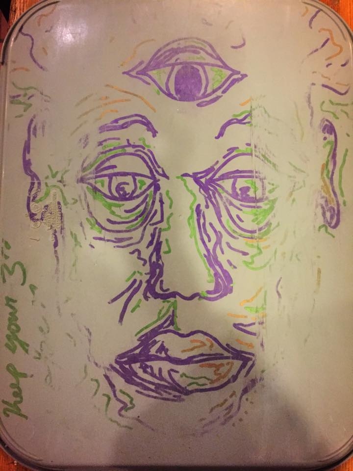 Sharples tray with a psychedelic face drawn on it by a student