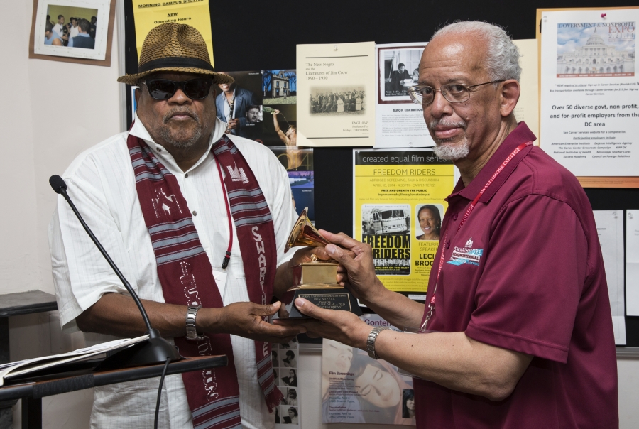 Don Mizell ’71 hands his Grammy to Maurice Eldridge ’61