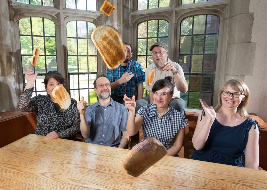 Photo of the Bulletin staff throwing toast at the camera.