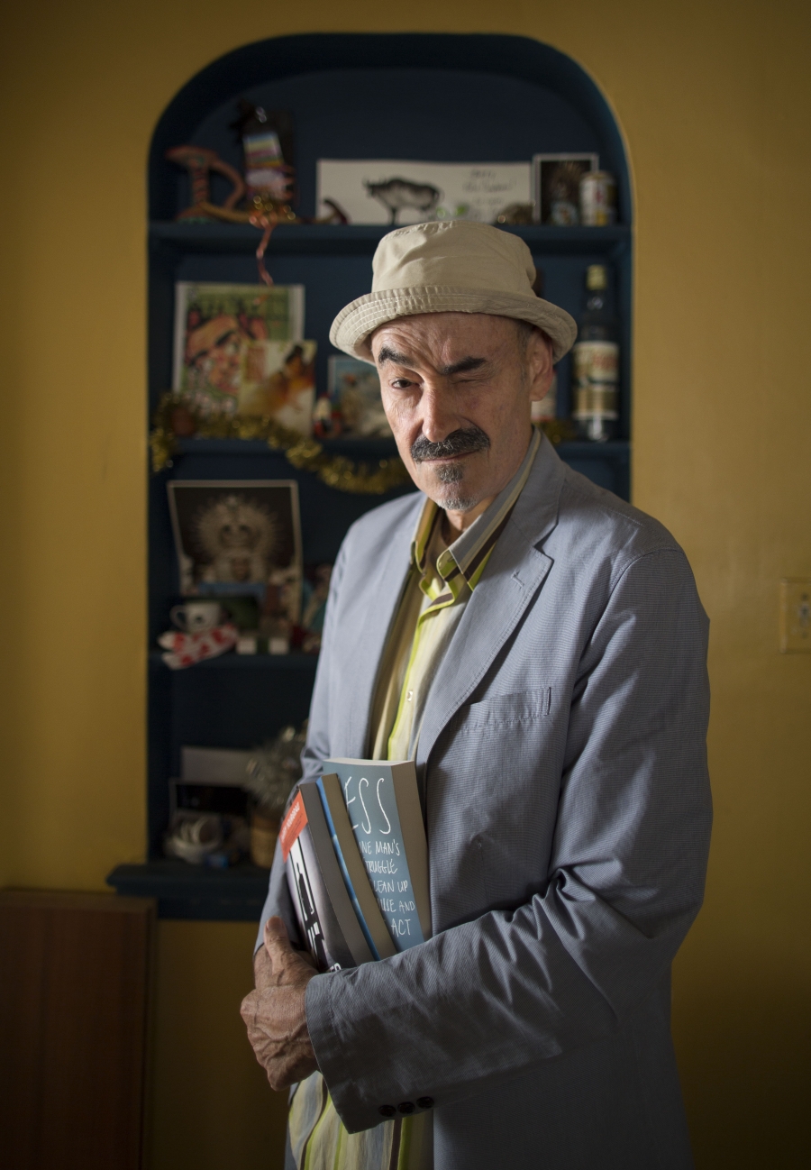 Barry Yourgrau ’70 stands in front of yellow walls