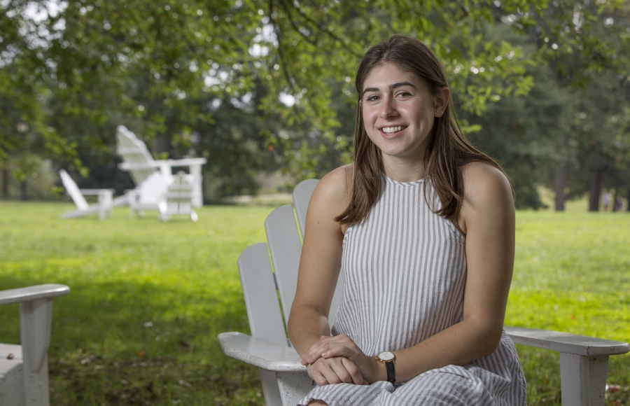Olivia Leventhal ’18 sitting in an Adirondack chair.