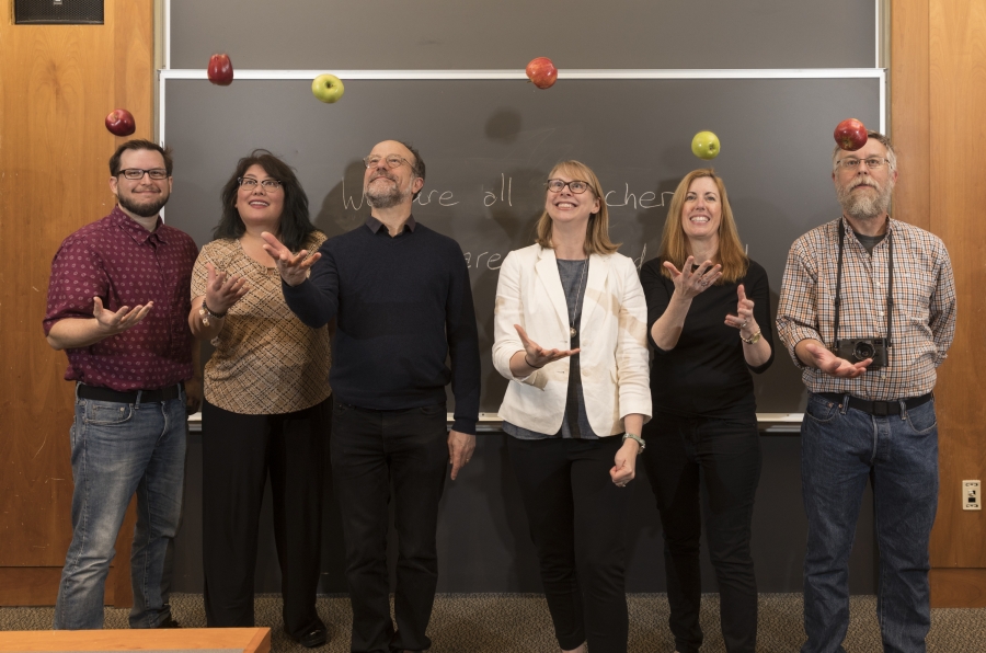 Bulletin staffers tossing apples in a classroom