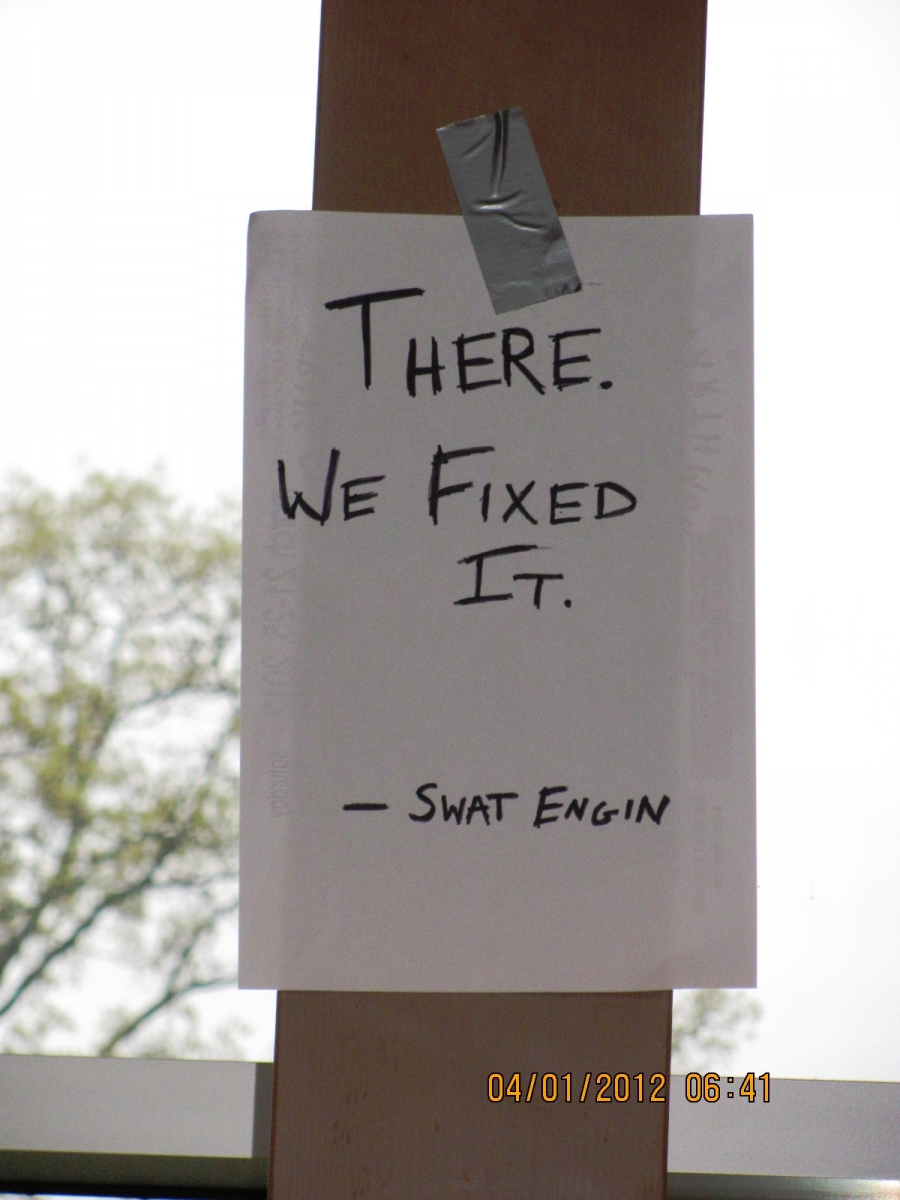 A sign says There we fixed it. 