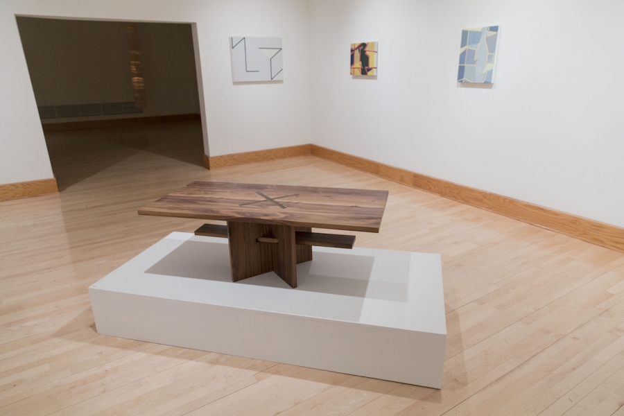 A shot of a gallery of Kelsey Rico 16’s art, including a geometrically carved table.
