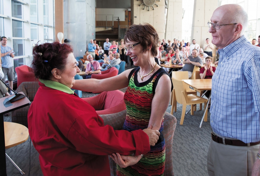 Lisa Scolaro embracing President Rebecca Chopp