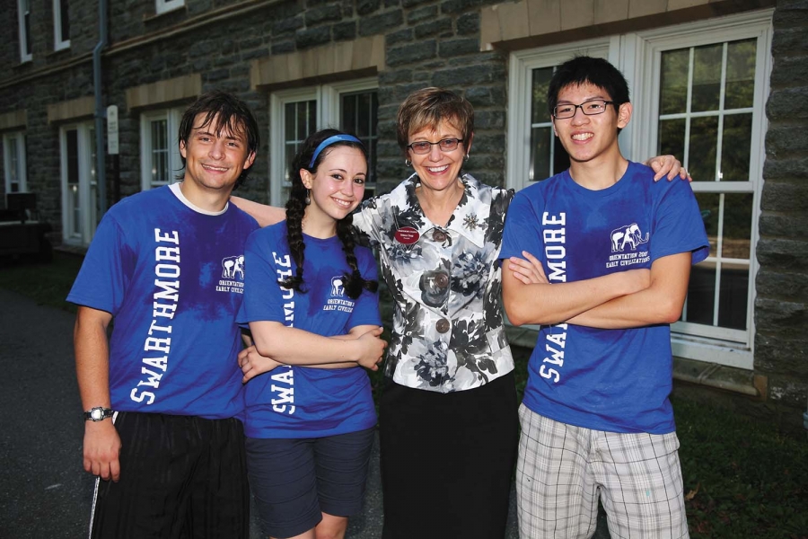 Rebecca Chopp with three students