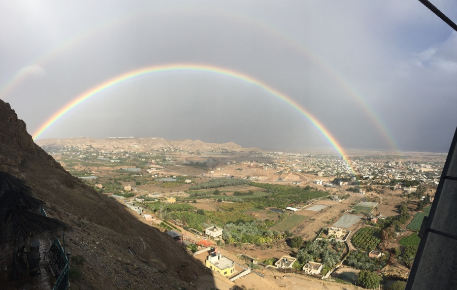 A rainbow over a valley. 