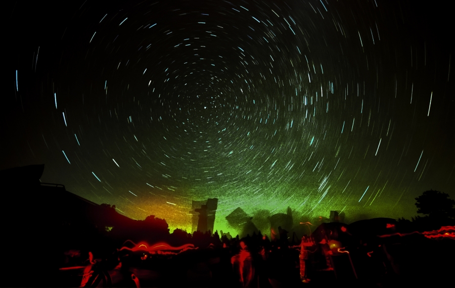 time-progression photo of star-blurred night sky