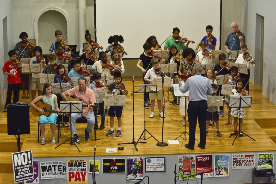 Ken Giles ’71 conducts his student orchestra