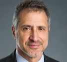 A portrait of Gustavo Schewd ’84 in a head shot.