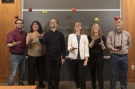 Bulletin staffers tossing apples in a classroom