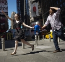 Marina Tempelsman and Nicco Aeed running through Times Square