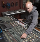 Scott Samels working at an audio mixer.